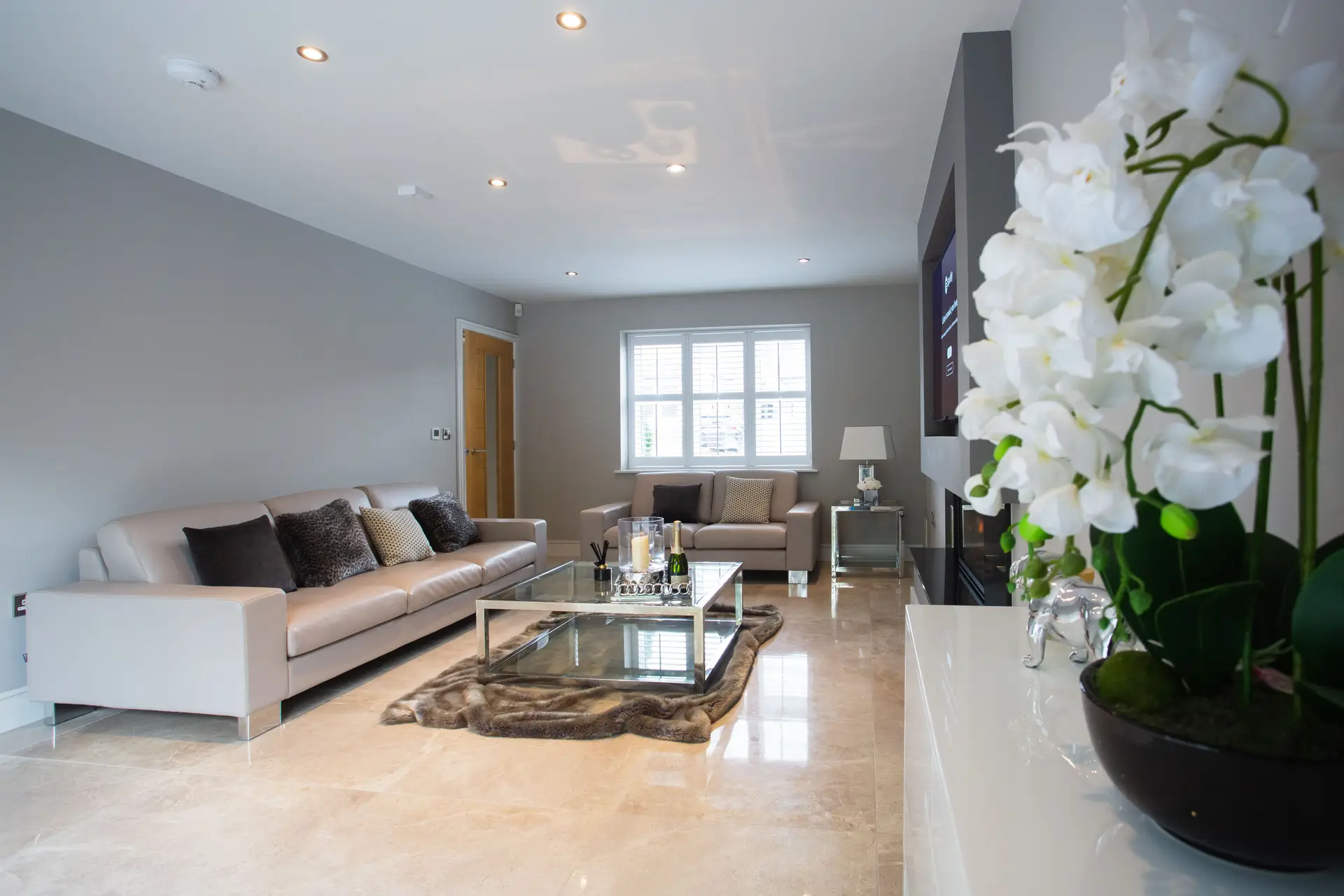 Curated textiles, ceramics and organic styling accents in a warm living room